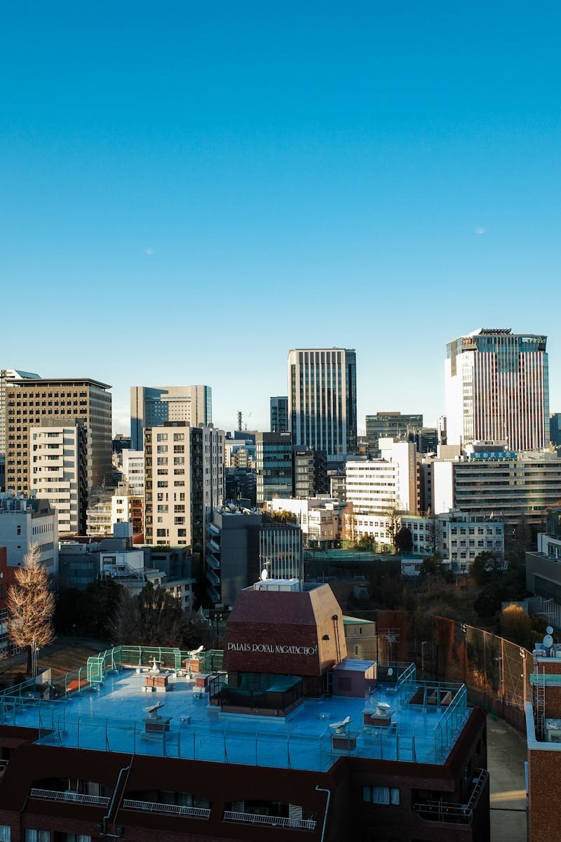 View of Chiyoda City Tokyo featuring modern skyscrapers under a clear blue sky.